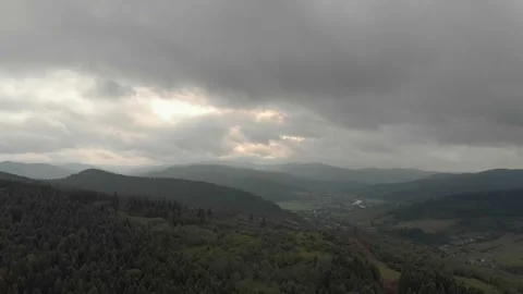 Aerial View Of Mountains, Clouds, Forests, And Sunlight. Vidéo 300740841