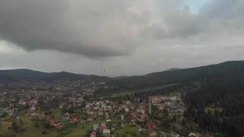 Aerial View Of Mountains, Clouds, Forests, And Sunlight. Vidéo 300741075