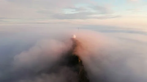 Aerial view of the mountains in the clouds at sunset. Faroe islands Stock Footage 170746243