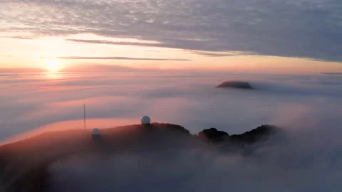 Aerial view of the mountains in the clouds at sunset. Faroe islands Stock Footage 170747780