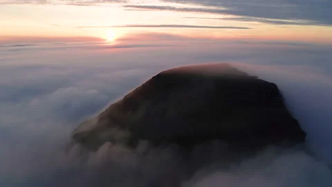 Aerial view of the mountains in the clouds at sunset. Faroe islands Stock Footage 170748489