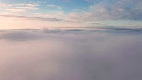 Aerial view of the mountains in the clouds at sunset. Faroe islands Stock Footage 195989262