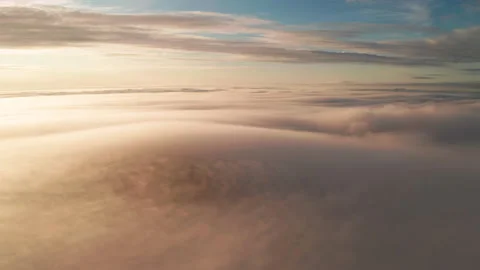 Aerial view of the mountains in the clouds at sunset. Faroe islands Stock Footage 195989500