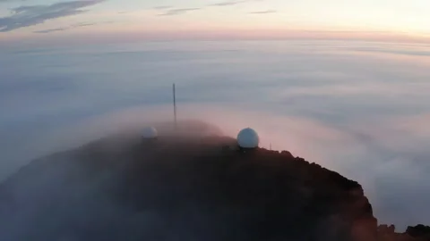 Aerial view of the mountains in the clouds at sunset. Faroe islands Stock Footage 195990042