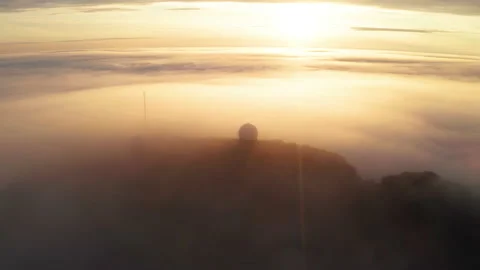 Aerial view of the mountains in the clouds at sunset. Faroe islands Stock Footage 195990209