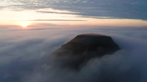 Aerial view of the mountains in the clouds at sunset. Faroe islands Stock Footage 195991426