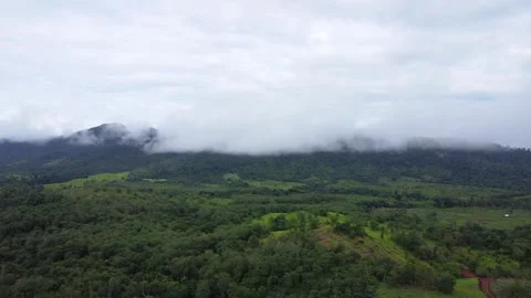 The aerial view of the mountains covered in clouds looks beautiful, piercin.. Stock Footage 301685251