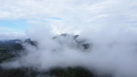 The aerial view of the mountains covered in clouds looks beautiful, piercin.. Stock Footage 301687506