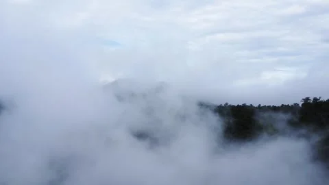 The aerial view of the mountains covered in clouds looks beautiful, piercin.. Stock Footage 301687878