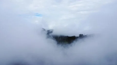 The aerial view of the mountains covered in clouds looks beautiful, piercin.. Stock Footage 301688773