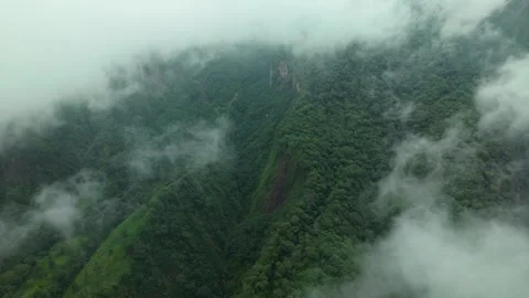 Aerial view of mountains covered in clouds, Indonesia. Stock Footage 321063431