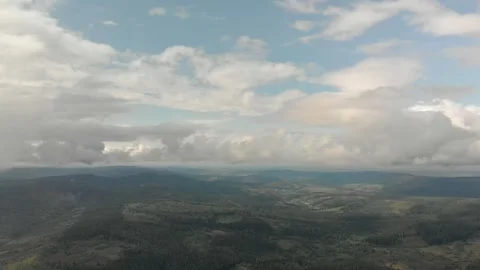 Aerial View Of Mountains, Forests, And Clouds. Vidéo 299848827