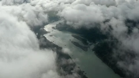 Aerial view of mountains, river in clouds and fog. Video stock 336739743