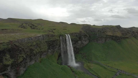 Aerial view to the mountains river flows through the valley and falls down Stock Footage 94352267
