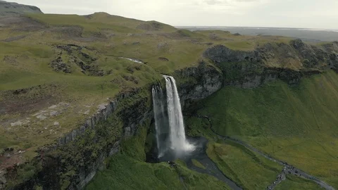 Aerial view to the mountains river flows through the valley and falls down Stock Footage 94352317