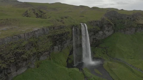 Aerial view to the mountains river flows through the valley and falls down Stock Footage 94352373