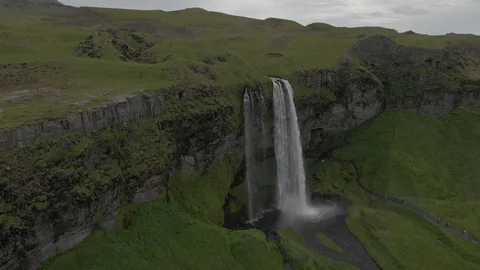 Aerial view to the mountains river flows through the valley and falls down Stock Footage 94352395