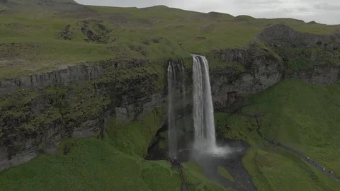 Aerial view to the mountains river flows through the valley and falls down Stock Footage 94352433