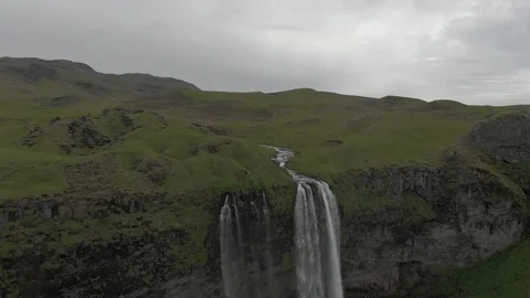 Aerial view to the mountains river flows through the valley and falls down Stock Footage 94352459