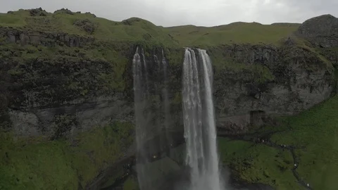 Aerial view to the mountains river flows through the valley and falls down Stock Footage 94352503