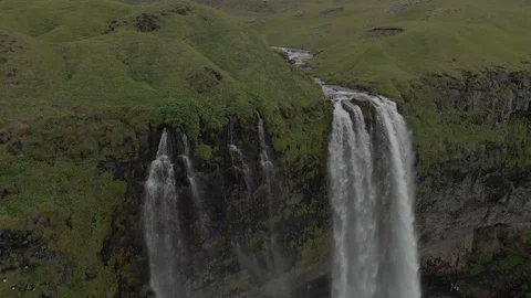 Aerial view to the mountains river flows through the valley and falls down Stock Footage 94352555