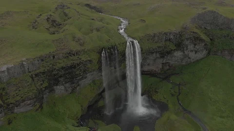 Aerial view to the mountains river flows through the valley and falls down Stock Footage 94352587