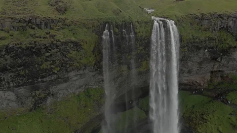 Aerial view to the mountains river flows through the valley and falls down Stock Footage 94352630