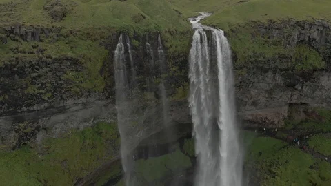 Aerial view to the mountains river flows through the valley and falls down Stock Footage 94352652