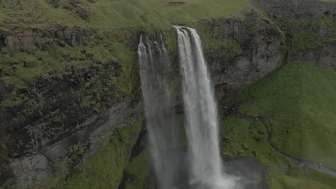 Aerial view to the mountains river flows through the valley and falls down Stock Footage 94352679