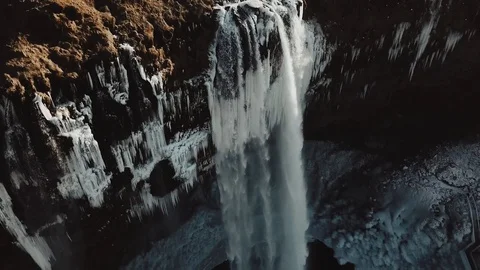 Aerial view to the mountains river flows through the valley and falls down. Stock Footage 97012140