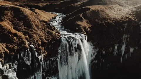 Aerial view to the mountains river flows through the valley and falls down. Stock Footage 97012161