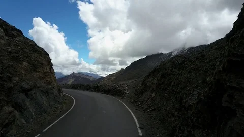 Aerial view of Mountains, Sky, Clouds and Road Stock Footage 75967620