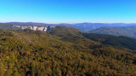 Aerial view Movement over the forest on the mountain ridge in autumn time Stock Footage 331247060