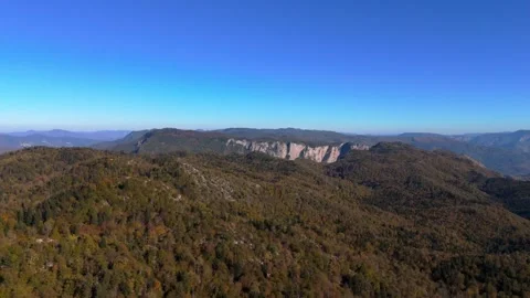 Aerial view Movement over the forest on the mountain ridge in autumn time Stock Footage 331247070