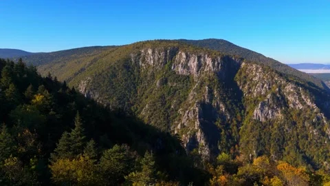 Aerial view Movement over the forest on the mountain ridge in autumn time Stock Footage 331247080