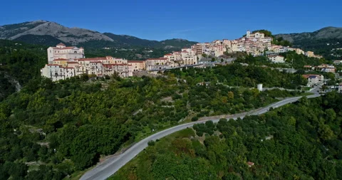 Aerial view, moving backwards, of the medieval city of Rivello in Basilicata. Stock Footage 233429928