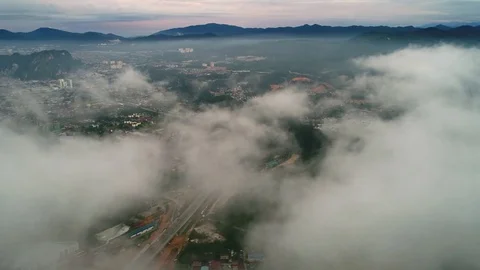 Aerial view. Moving at clouds level while viewing busy expressway . Видео 81151407