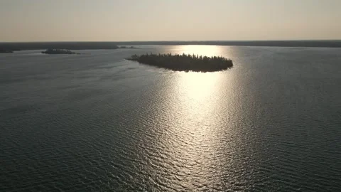Aerial view moving forward over a large lake early or late in the day  Stock Footage 255658602