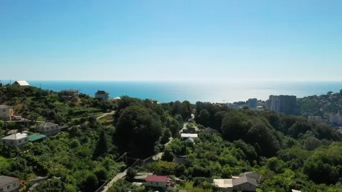 Aerial view. Moving forward. Sochi city resort near the Black sea. Vidéo 114683916