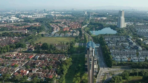 Aerial view of moving Light Rail Transit (LRT) near Putra Heights station Stock Footage 127015201
