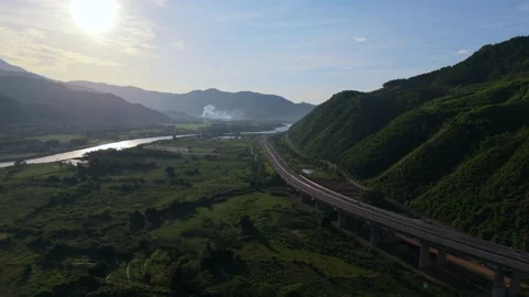 Aerial View Moving Right Over Highway and River Valley in Central Vietnam Stock Footage 337807690