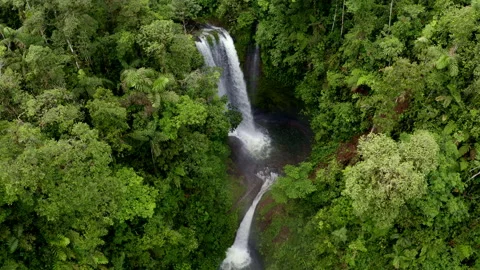Aerial view, moving to a top view of a waterfall consisting of two cascades Stock Footage 169925302