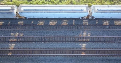 Aerial View Of A Moving Train And Multiple Tracks Vídeo Stock 92756508