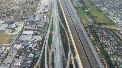 Aerial view of moving vehicles all around on freeway interchange Video stock 114841453