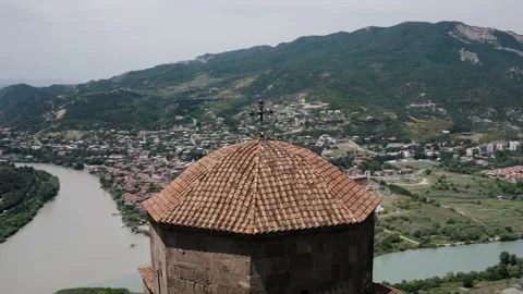 Aerial view of Mtskheta. Drone flying around the dome of the monastery Jvari. Stock Footage