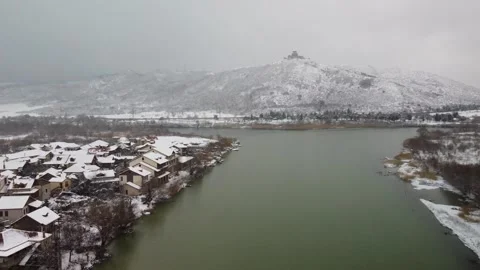 Aerial view of Mtskheta (Georgia) and old Jvari Monastery in winter Stock Footage 242430536