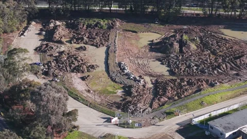 Aerial view of a muddy construction site development Stock Footage 341261171