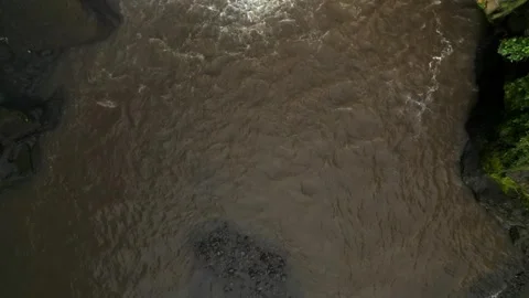 Aerial View of Muddy River in Tropical Jungle, Ubud, Bali, Indonesia Stock Footage 340658507