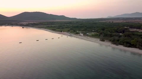 Aerial view of Mugoni beach near Alghero in Sardinia island at sunset, with.. Stock Footage 308667953