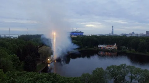 Aerial view of multi-colored Festive Salute above the lake in park at evening. Stock Footage 128565830